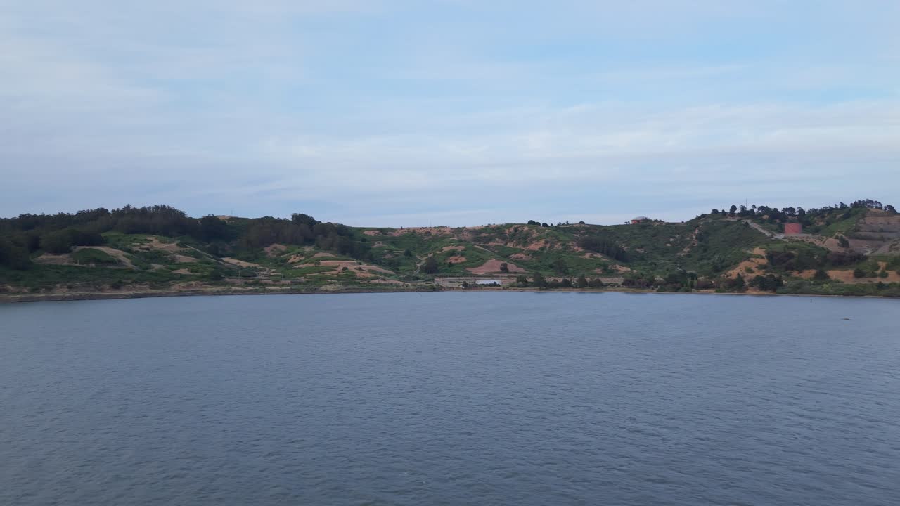 Sunlight filters through coastal haze as a drone sweeps across Point Molate’s scenic beach and quiet inlets.