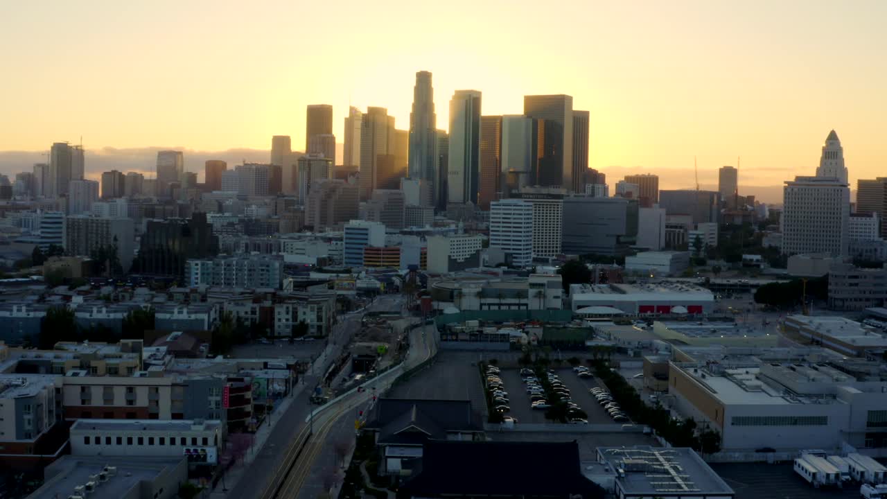 4K aerial of empty Downtown LA skyline silhouette at sunset during the COVID-19 outbreak.