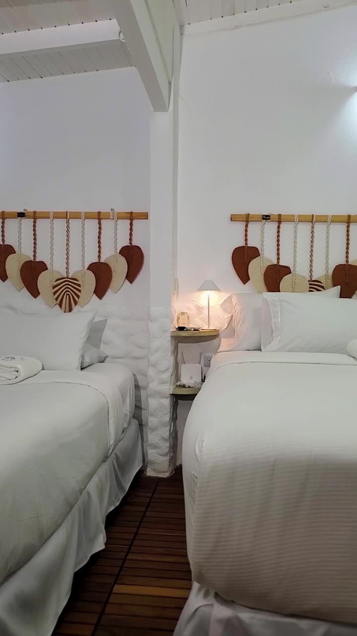 Experience the tranquility of a beautifully woven white hammock set in a stylish family room. The bright space features light walls and warm wooden accents enhancing the mood of relaxation