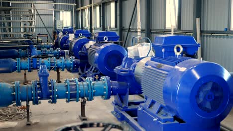 equipment at the electric pumping station. pumps deliver water to the irrigation tank from a nearby flowing river. modern technologies in irrigation of farm fields