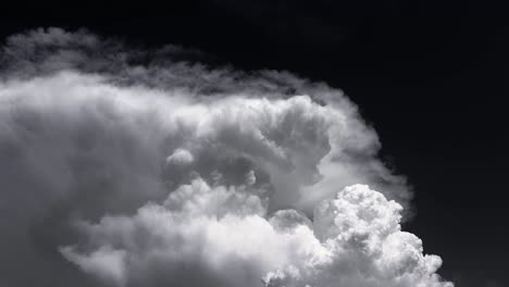 white smoke like clouds on a black sky background time lapse footage.