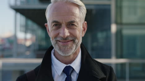 portrait of corporate businessman smiling close up of mature leader ceo