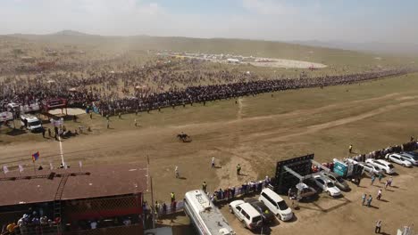 aerial drone shot during naadam festival horse race finishing line mongolia