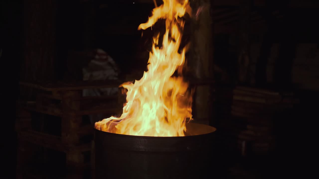 Burning Fire in a Barrel at Night