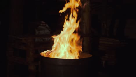 burning fire in a barrel at night