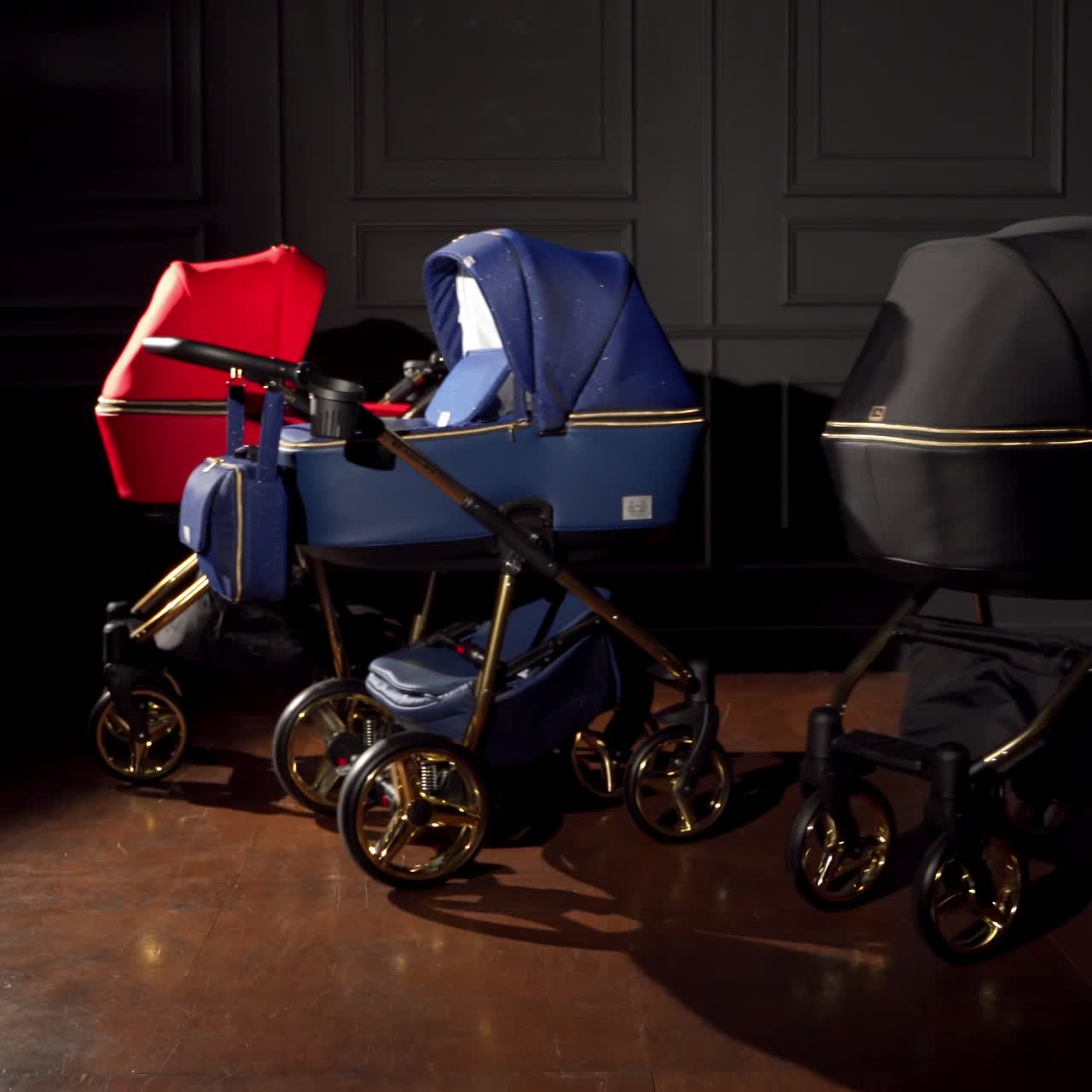 Beautiful new prams displayed in a room. Baby strollers moving at the dark space background