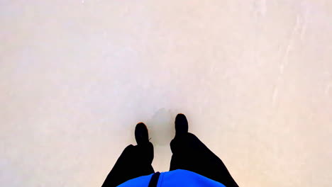 person walking on ice, pov view