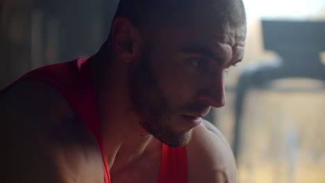 close-up:a dedicated athlete lifts a barbell with a weight for biceps training in the gym. training arms and biceps. powerful man trains hard to achieve the goal.