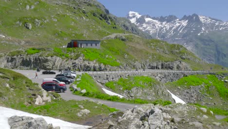 mountain road and car park with a scenic view of the swiss alps