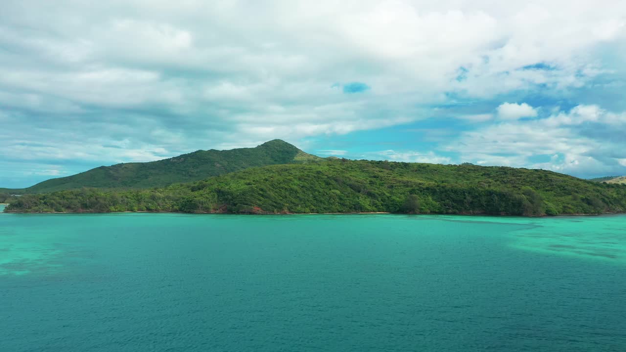 The beautiful, pristine green Fiji islands with bright blue waters - aerial