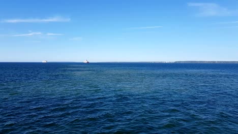 view of the ocean and clouds in the sky. blue sky with clouds in sunny weather over the ocean.