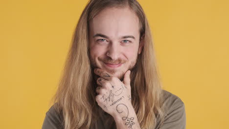 caucasian young man thinking in front of the camera.