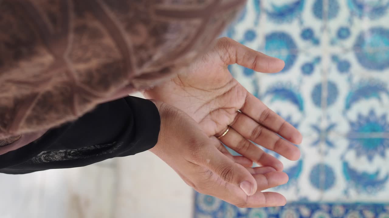 Hands showcasing Islamic art tile pattern