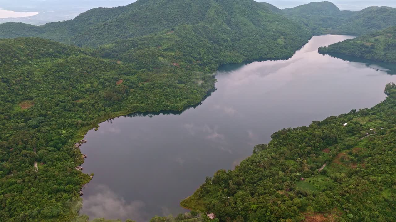 Fixed aerial shot of Lake Danao in Leyte showing cloud reflections on calm water surface.