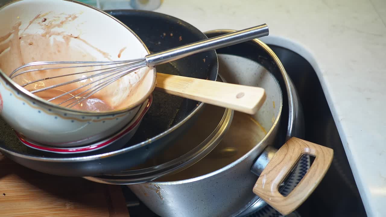 Pile of dirty dishes after cooking