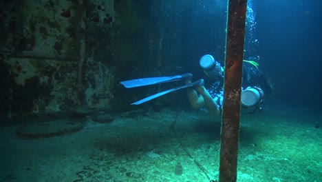 diver inside a shipwreck