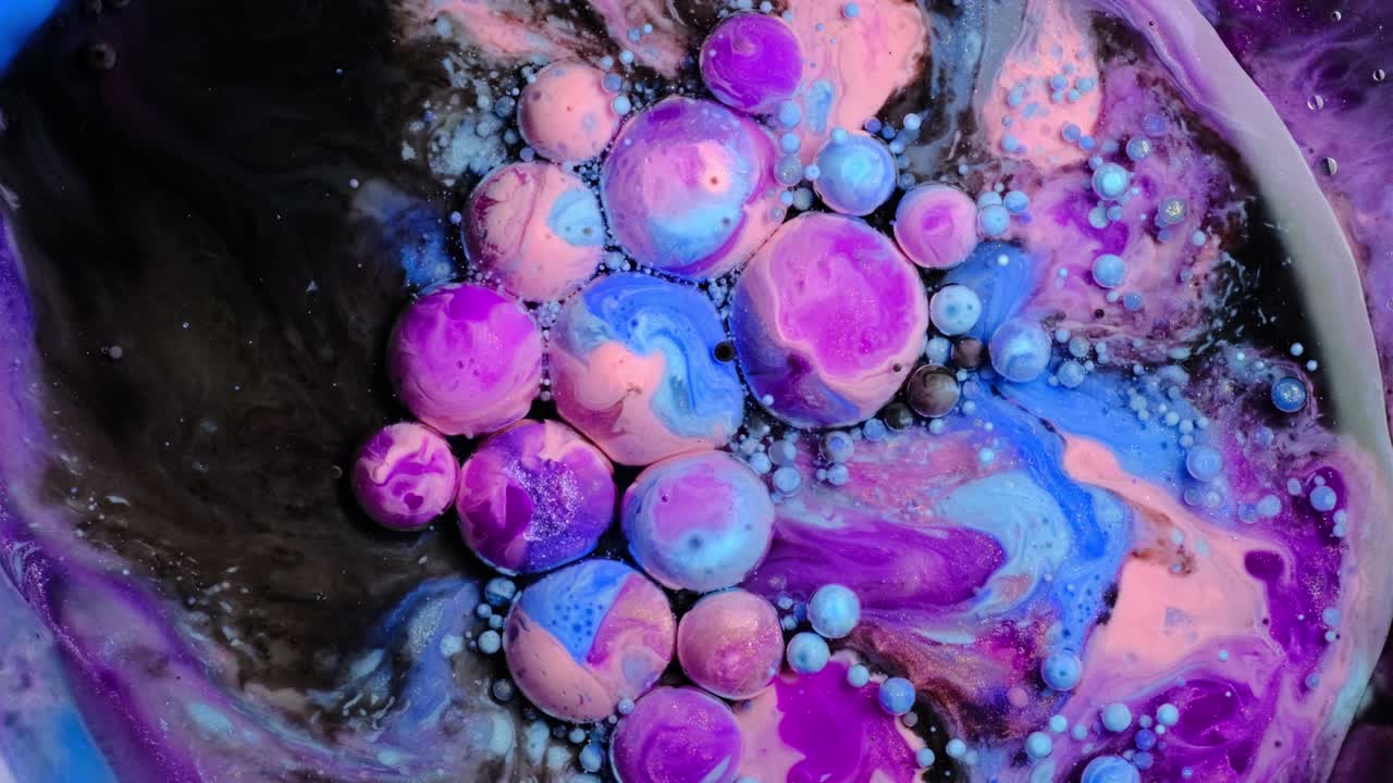 Colorful paint and bubbles abstract background 4k video