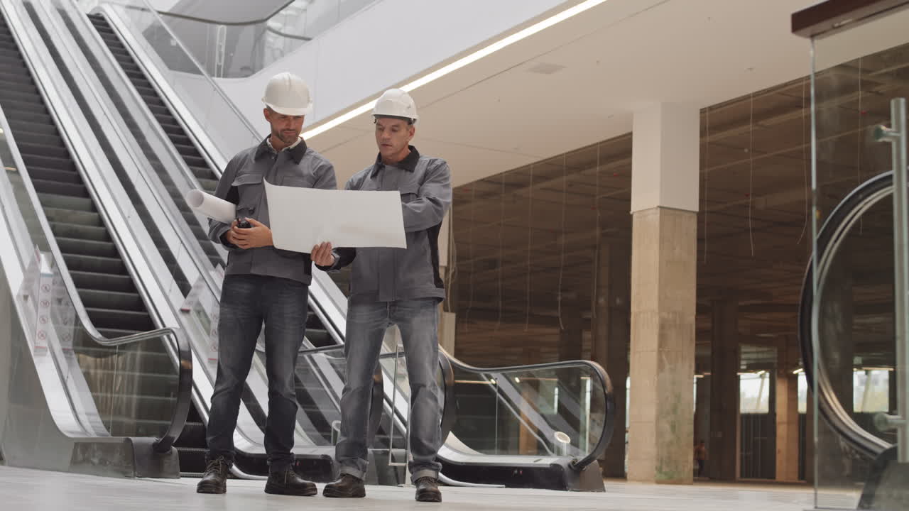 Male Engineers Working with Papers