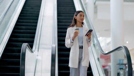 Phone,-coffee-and-a-business-woman-on-an-escalator