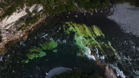 top-down view of fast-flowing rapids of a mountain stream in abisko national park, sweden