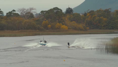 slalom water skier rounds buoy