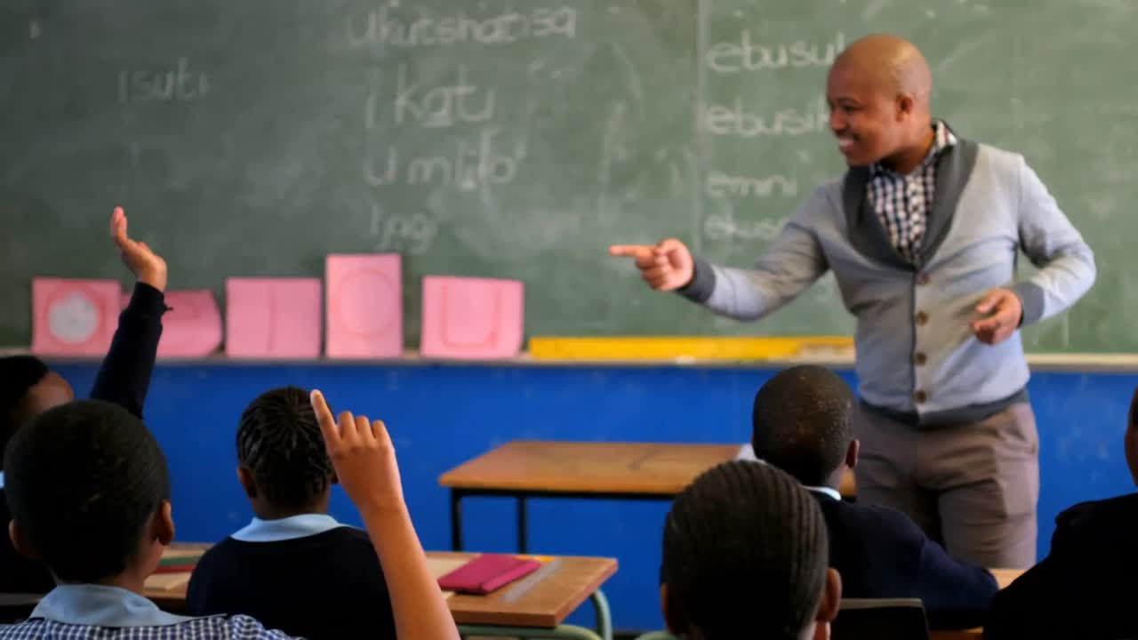 Male teacher teaching students in the classroom 4k
