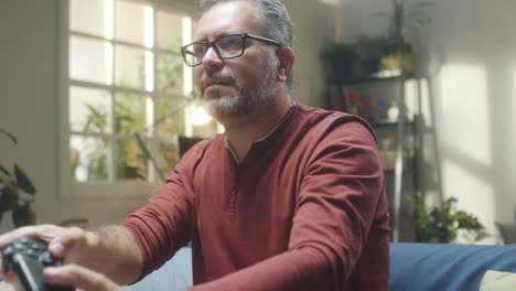 man playing video games at home