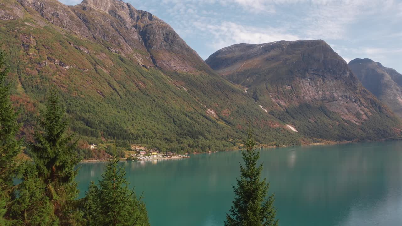 Mountain lake in Norway with clear water, forest and calm peaceful atmosphere