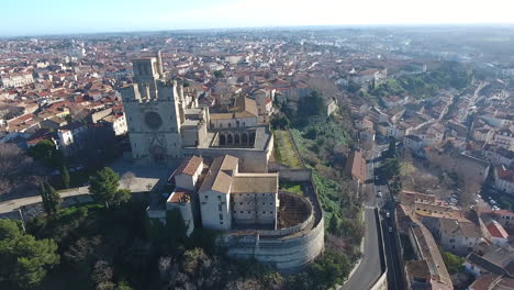 béziers cathedral with the city in background aerial drone view sunny day blue