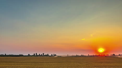 a time lapse shot of a sunrise view with a wind shear and a crop field landscape