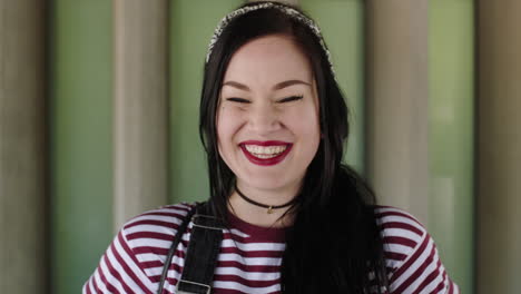 portrait of proud young woman smiling laughing independent wearing stripe shirt