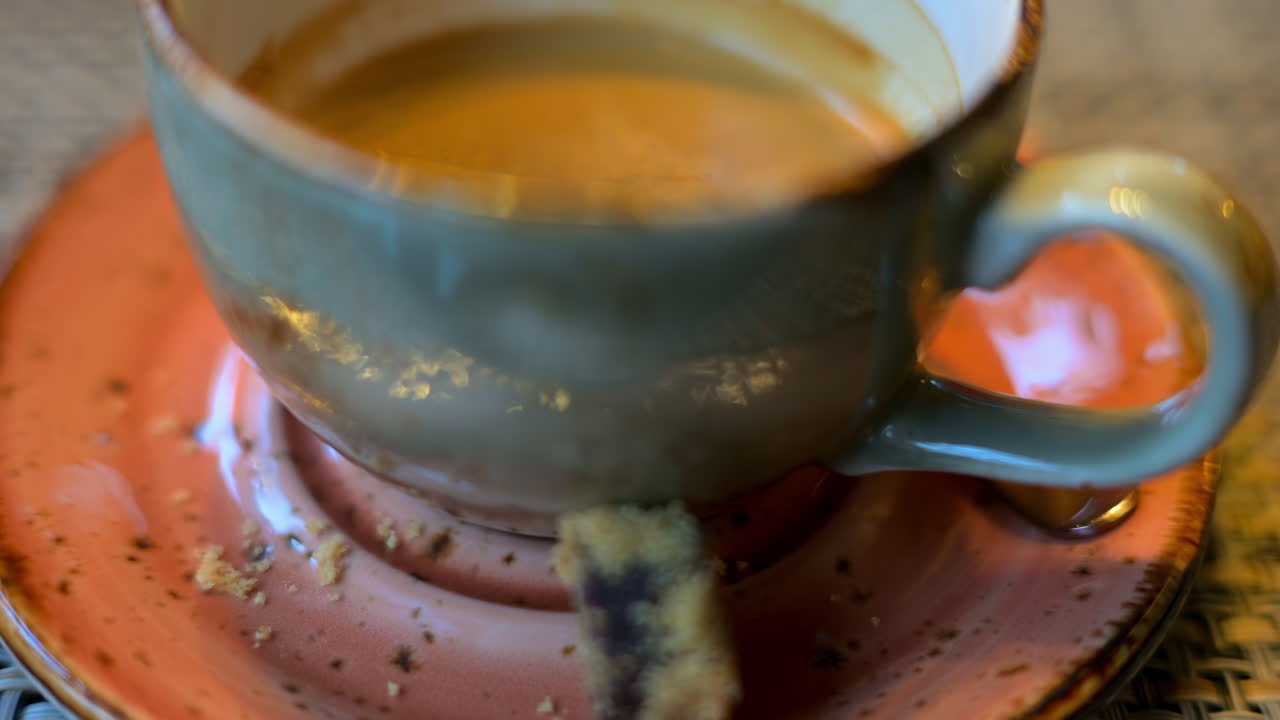 Cup of coffee in a ceramic mug in a rustic environment