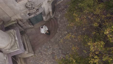 lovely newlyweds caucasian bride and groom with bouquet in park, wedding couple first meeting