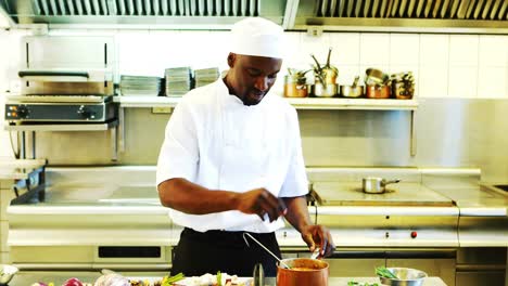 chef preparing food in commercial kitchen