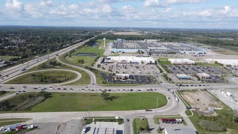 Commercial-shopping-area-in-Woodhaven-Michigan,-aerial-drone-view