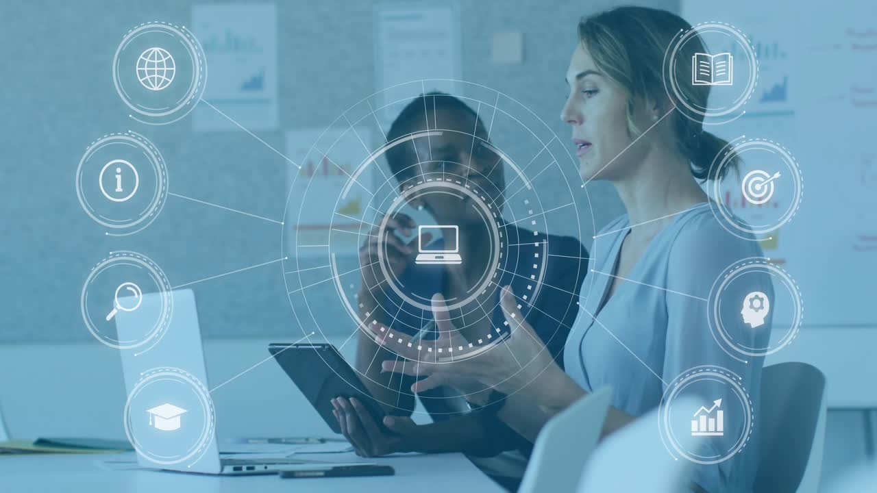 Analyst tapping tablet and lead talking in meeting HUD growing showing laptop icon for project plan
