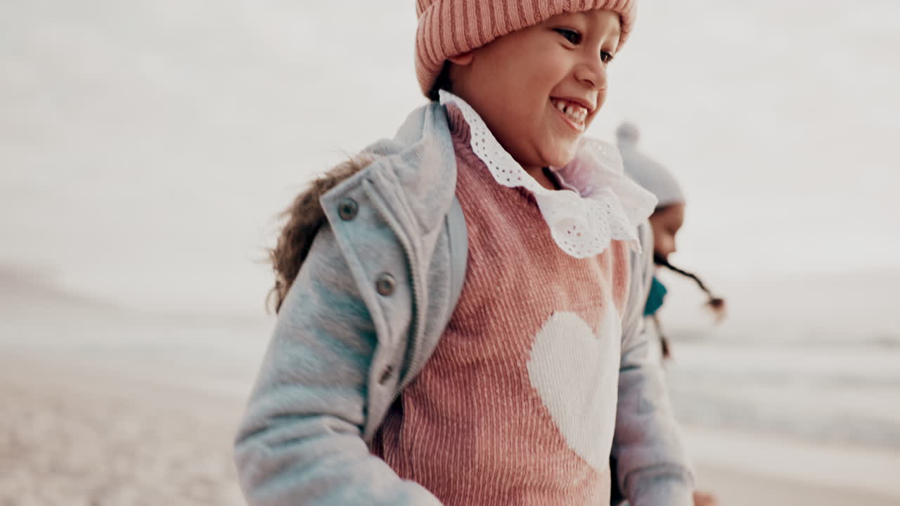 Family, sister and children running on the beach