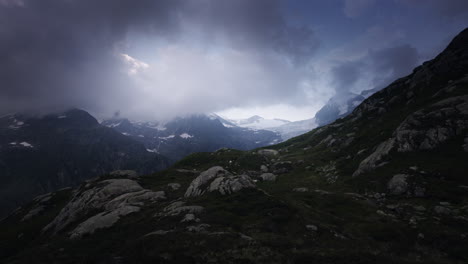 alpine mountain scenery with clouds and hiking trail