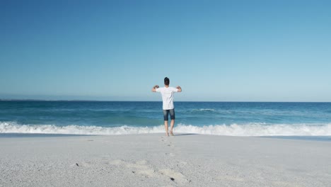 man standing on the beach