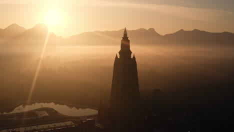 sunrise over a temple in thailand