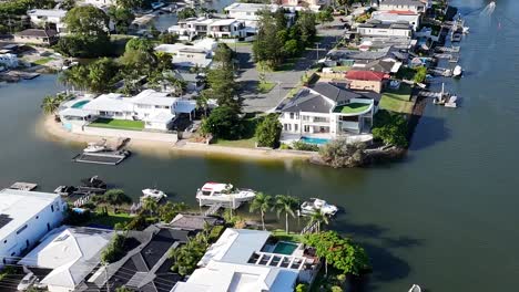 aerial view of waterfront homes with private docks along a serene canal.