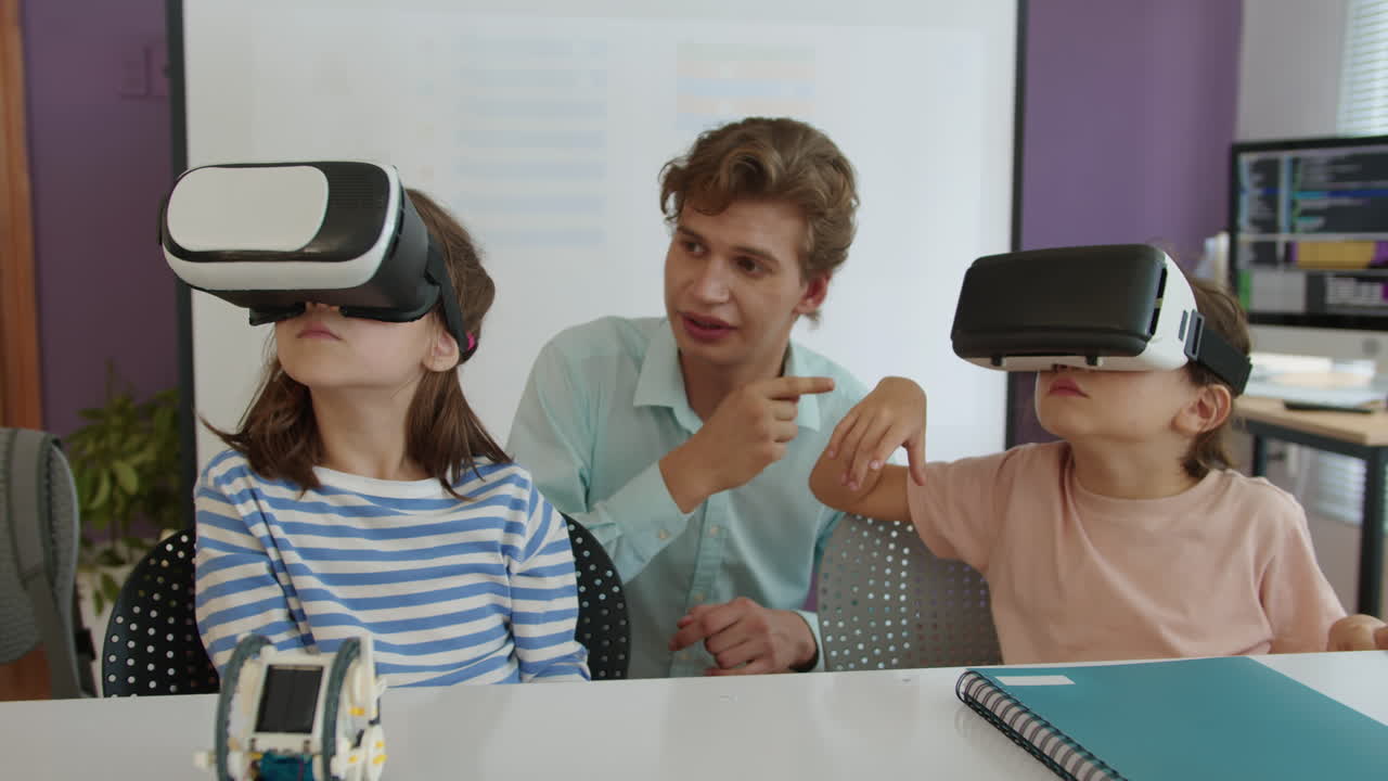 Tutor Teaching Kids to Use Virtual Reality Glasses at Lesson