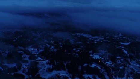 clouds moving over a winter landscape at night