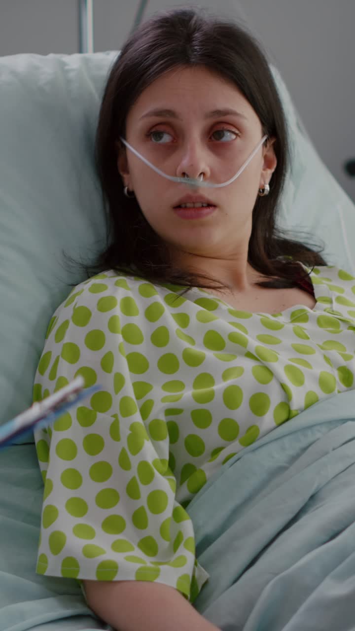 Vertical video: Specialist oncologist physician writing medical expertise on clipboard