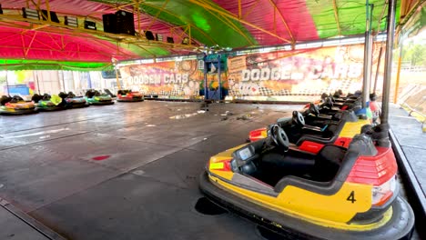 empty bumper cars at a colorful fairground