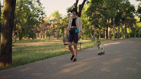 woman walks her dog in the park