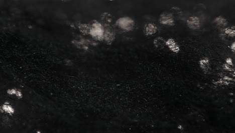 fire burning through dark, black surface, abstract motion with smoke and light contrast