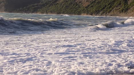 waves moving in slow motion on a beautiful beach during sunset