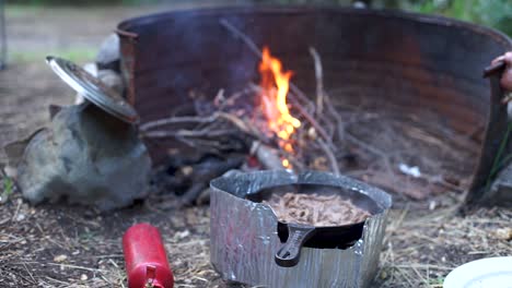 campfire cooking meat in southern argentina, close up