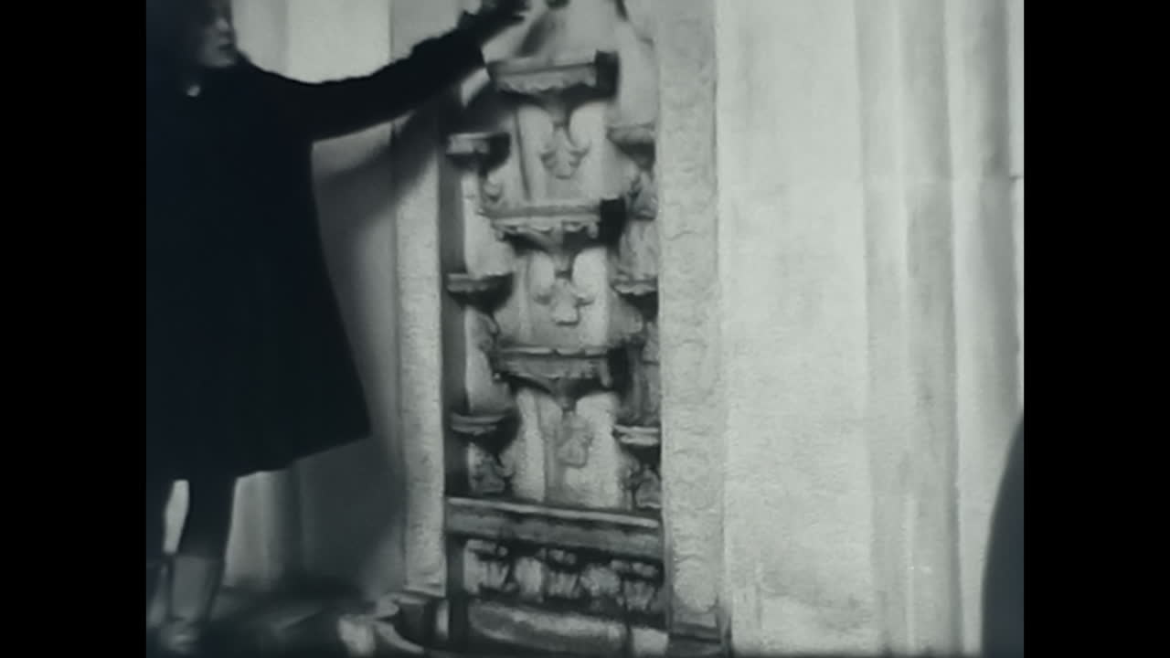 Group of People Walking Next to Tall Buildings in the Streets of the Soviet Union. CIRCA USSR 1970: A group of Soviet people walking down a street surrounded by tall buildings during the era of communism and socialism.